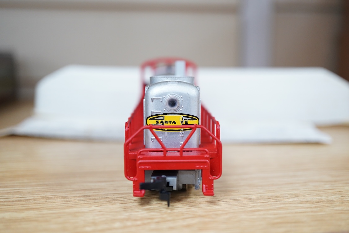 A quantity of US outline HO railway by Athearn, Bachmann, etc. including three locomotives; a Union Pacific Bo-Bo diesel, 1468, a Santa Fe Bo-Bo diesel, 5707, and a Santa Fe 0-4-0 tender engine, together with a 12-wheel